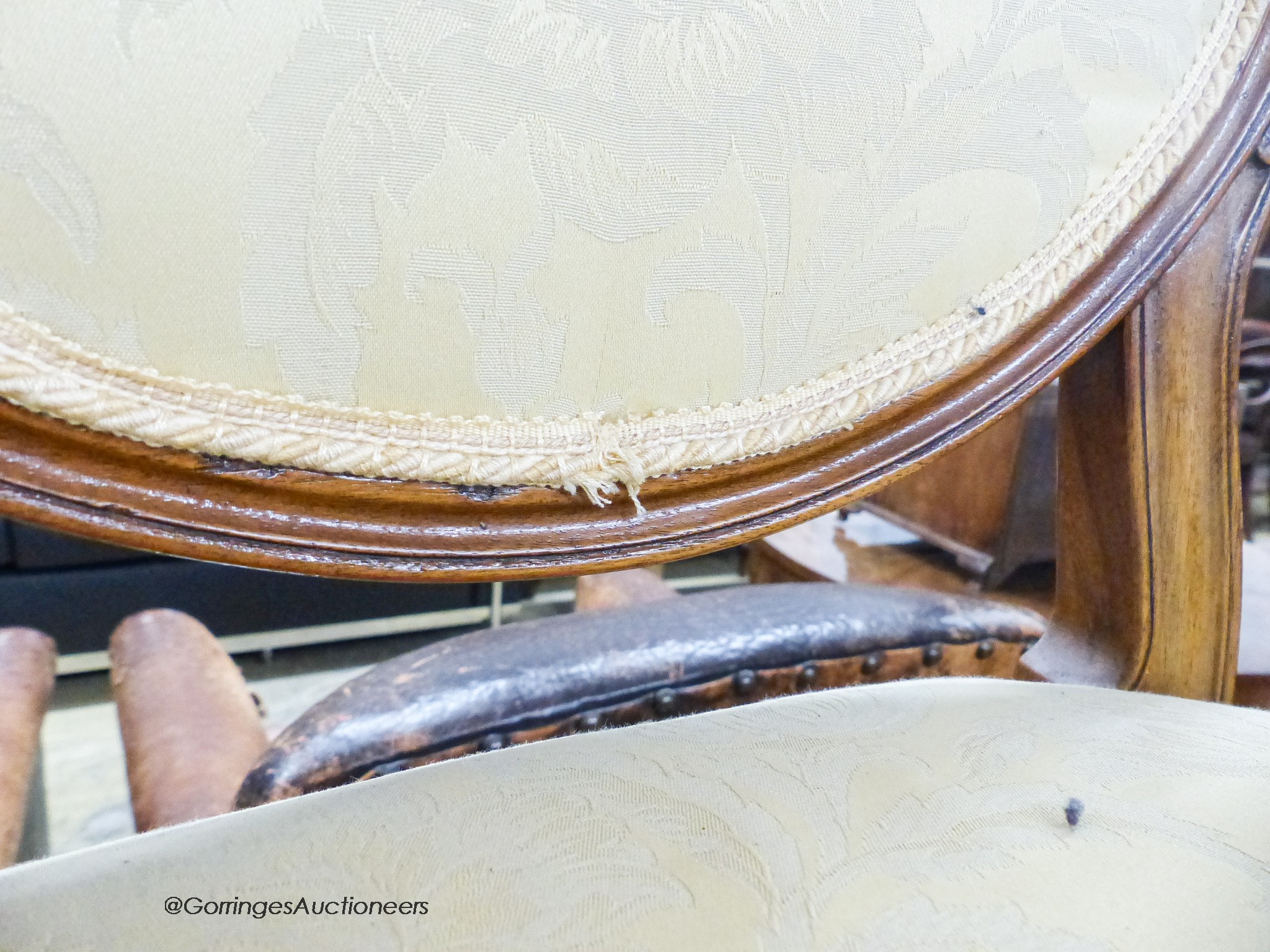 A pair of upholstered elbow chairs, width 57cm, height 100cm
